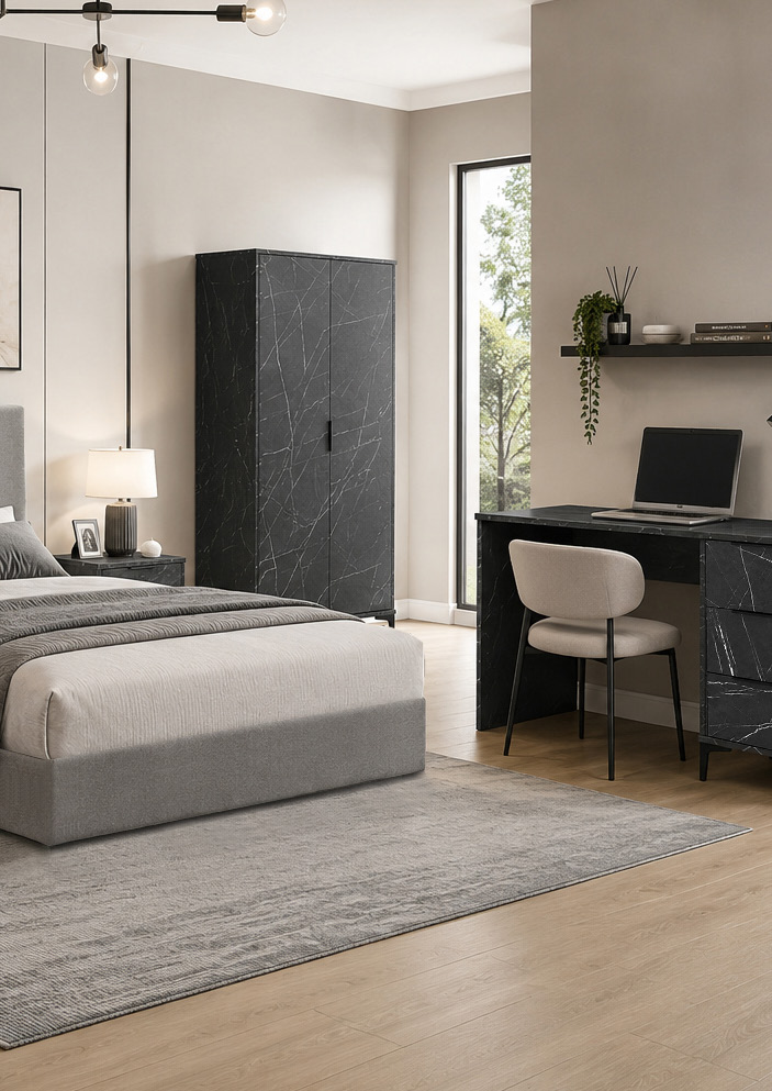 A styled show home bedroom with a study area